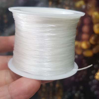Cuộn Dây Thun CO GIÃN màu Trắng xỏ vòng hạt chuỗi Dây này là dây thun chuyên xỏ vòng chuỗi màu Trắng, có đủ màu Anh Chị đang đeo chuỗi muốn thay dây khác cho vòng thì đặt cuộn Thun chỉ này nhé 