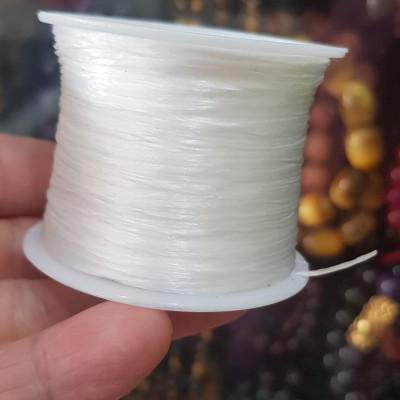 Cuộn Dây Thun CO GIÃN màu Trắng xỏ vòng hạt chuỗi Dây này là dây thun chuyên xỏ vòng chuỗi màu Trắng, có đủ màu Anh Chị đang đeo chuỗi muốn thay dây khác cho vòng thì đặt cuộn Thun chỉ này nhé 
