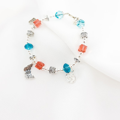 Vòng tay mệnh đá pha lê mix charm hoa+ tim