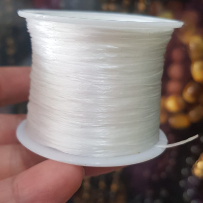 Cuộn Dây Thun CO GIÃN màu Trắng xỏ vòng hạt chuỗi Dây này là dây thun chuyên xỏ vòng chuỗi màu Trắng, có đủ màu Anh Chị đang đeo chuỗi muốn thay dây khác cho vòng thì đặt cuộn Thun chỉ này nhé 