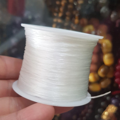 Cuộn Dây Thun CO GIÃN màu Trắng xỏ vòng hạt chuỗi Dây này là dây thun chuyên xỏ vòng chuỗi màu Trắng, có đủ màu Anh Chị đang đeo chuỗi muốn thay dây khác cho vòng thì đặt cuộn Thun chỉ này nhé 
