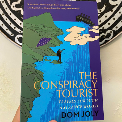 Sách - The Conspiracy Tourist: Travels Through a Strange World by Dom Joly | Travel Nonfiction